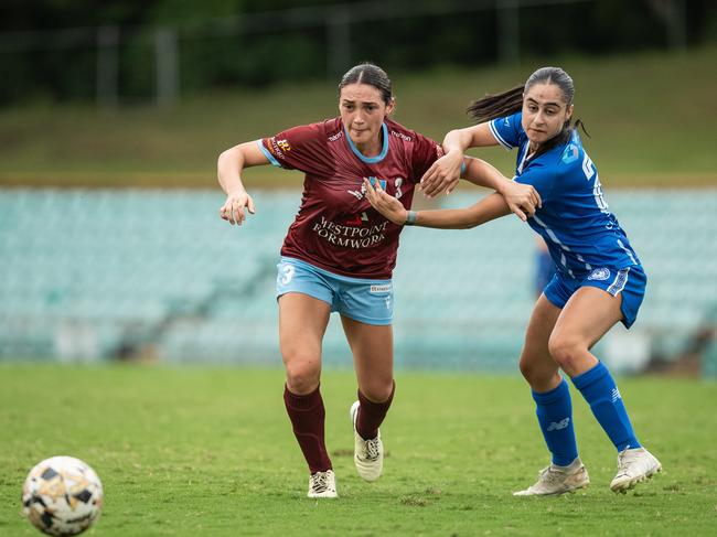 Tania Borazio fighting for the ball against the Olympic defence. Picture: Julian Andrews