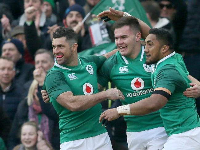 Ireland's wing Jacob Stockdale (C) celebrates with Ireland's full-back Rob Kearney (L) and Ireland's centre Bundee Aki (R) after scoring Ireland's first try during the Six Nations international rugby union match between Ireland and Wales last year. Picture: AFP