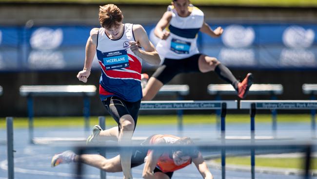 Jannik McErlane from Sydney Pacific in the lead as Mackenzie Goonan from Hornsby District falls.