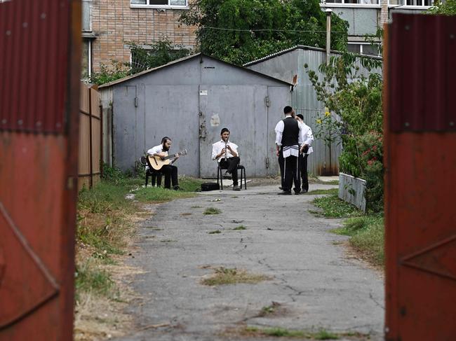 Hasidic Jewish pilgrims perform music in a yard of a house ahead of the Jewish new year of ‘Rosh Hashanah’ in Uman, central Ukraine. Over 20,000 Jewish pilgrims have arrived in Ukraine for the celebration, despite warnings from Kyiv not to travel for the religious holiday due to the Russian invasion. Thousands of Orthodox Jews come to Uman from Israel and other parts of the world every year to celebrate the holiday in the central Ukrainian city, one of the birthplaces of the Hasidic movement. Picture: Genya Savilov/AFP 