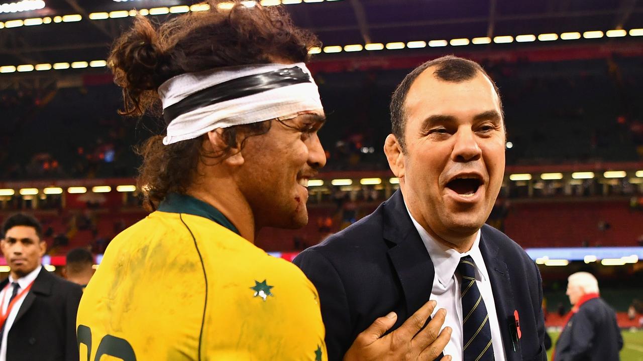 Karmichael Hunt of Australia shares a joke with Michael Cheika in 2017 in Cardiff.