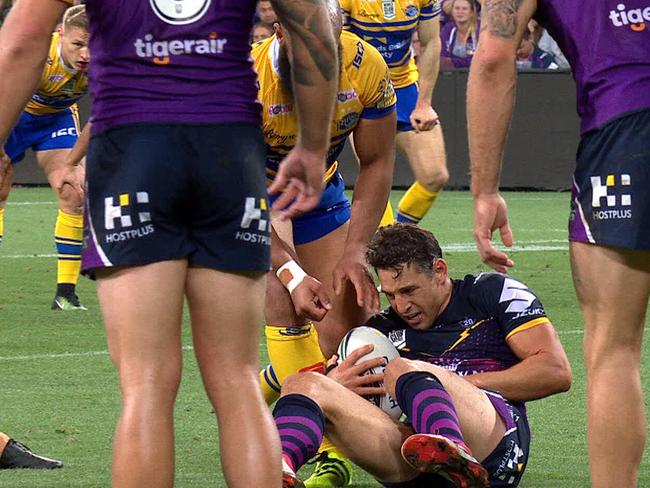 Billy Slater goes down on his left arm.