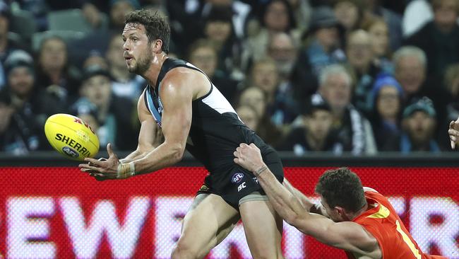 Travis Boak gets his handpass out against the Gold Coast. Picture: Sarah Reed