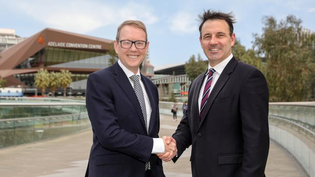 SeaLink outgoing chief executive Jeff Ellison with Transit Systems chief Clint Feuerherdt. Picture supplied by SeaLink/Transit Systems.