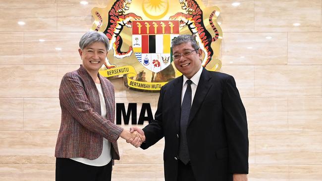 Australian Foreign Minister Penny Wong with her Malaysian counterpart Saifuddin Abdullah upon her arrival at the Ministry of Foreign Affairs in Putrajaya. Picture: Handout / Malaysia Ministry of Foreign Affairs / AFP