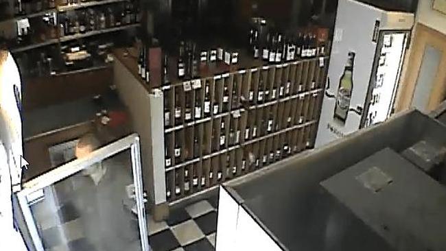 Pesky ghost or plain weird? A wine bottle falls and smashes behind a staff member. Picture: Facebook.