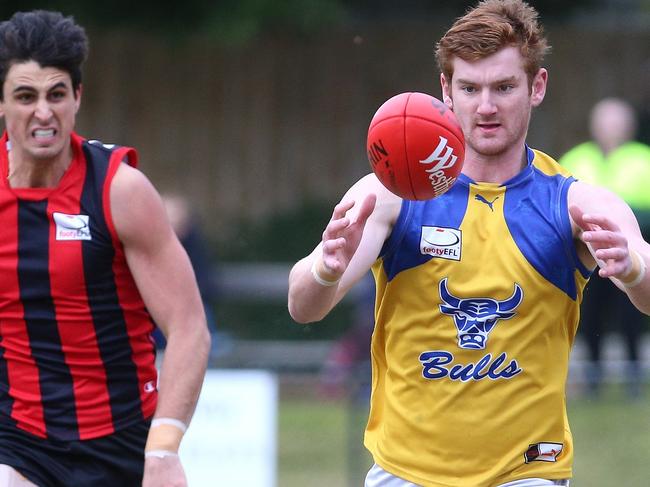 Ryan Morrison of Noble Park leads Jake Hammond of Blackburn to the ball during the EFL Division 1 match between Blackburn and Noble Park played at Morton Park on Saturday, July 8, 2017 in Blackburn, Victoria, Australia.Picture: Hamish Blair