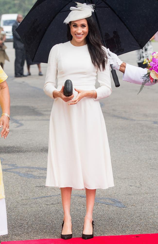 Meghan wore a Zimmerman dress, Stephen Jones hat, earrings gifted from the Queen and a bracelet from Princes Charles, and the same Aquazurra pumps we’ve seen her in earlier this week. Picture: Samir Hussein