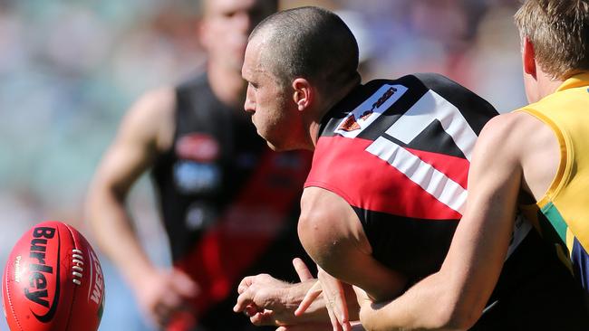 In control ... Jason Porplyzia gets a handball away in the SANFL grand final. Picture: Calum Robertson