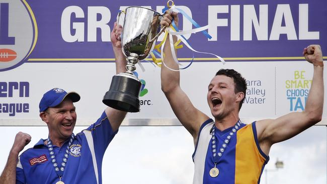 Macleod coach Garry Ramsay and captain Kane Shaw lift the 2015 NFL Division 1 premiership cup. Picture: Hamish Blair