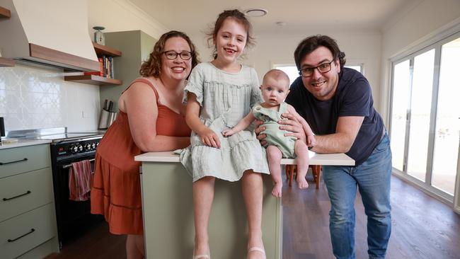 Matt Hatton and Erin Riley with their children, Abigail, 6, and Felicity, 11 weeks, at their new home. Picture: Justin Lloyd.