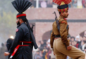 Beating the Retreat ... an Indian Border Security Force soldier (R) and a Pakistan Rangers soldier (L) at the India-Pakistan joint border check post of Wagah / AP