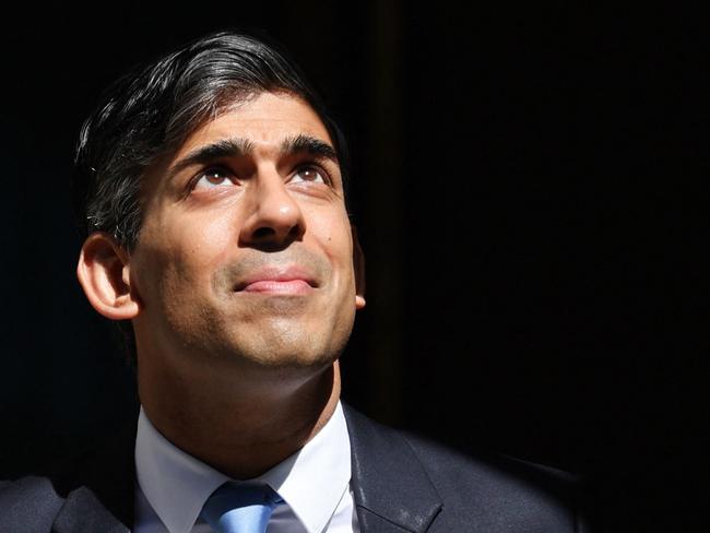 (FILES) Britain's Prime Minister Rishi Sunak reacts as he leaves 10 Downing Street in central London on May 8, 2024 to take part in the weekly session of Prime Minister's Questions (PMQs) in the House of Commons. Rishi Sunak is seeking his own public mandate at next month's general election, on July 4, 2024, having been installed as Conservative leader and UK prime minister by his own colleagues in parliament. The 44-year-old former financier was tasked with stabilising the UK economy, and his own notoriously fractious party, when he succeeded Liz Truss in October 2022 after her 49-day premiership imploded. (Photo by Adrian DENNIS / AFP)