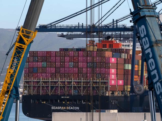 Hong Kong flagged container ship Seaspan Beacon is pictured at the port in Ensenada, Baja California state, Mexico on March 4, 2025. US President Donald Trump could announce a compromise tariff arrangement with Canada and Mexico on March 5, 2025, his commerce secretary said in an interview, shortly after sweeping 25-percent levies went into effect. (Photo by Guillermo Arias / AFP)