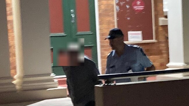 A 39-year-old man has been jailed for eight months after being caught with child exploitation material, including images he made with the young autistic child of his then partner. He is pictured being led out of the court by a police officer.