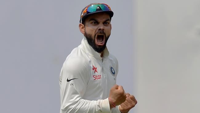 Indian captain Virat Kohli celebrates the dismissal of Australian batsman Matthew Wade.