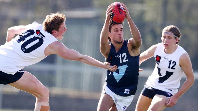 Vic Metro’s Nick Daicos dances his way through traffic. Picture: Michael Klein