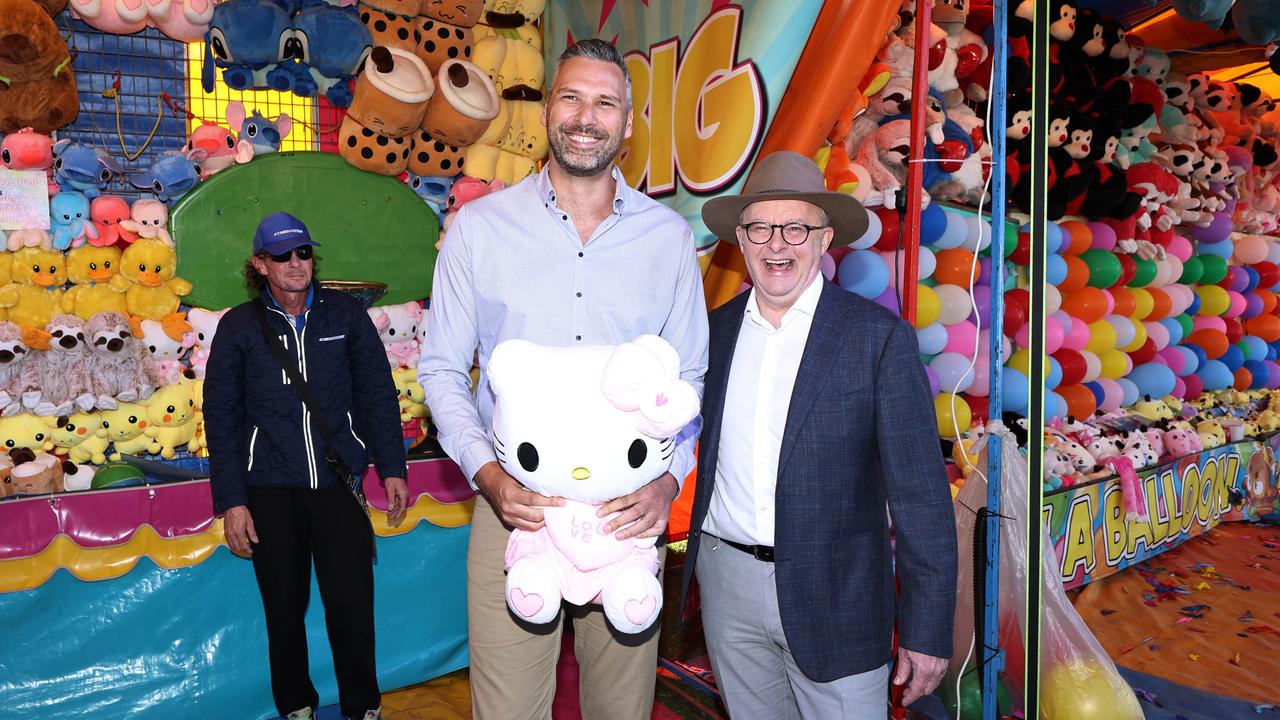 Labor Party candidate for Leichhardt Matt Smith and Australian Prime Minister Anthony Albanese with their Hello Kitty plush toy won on the basketball skills game at the final day of the Cairns Show. Picture: Brendan Radke