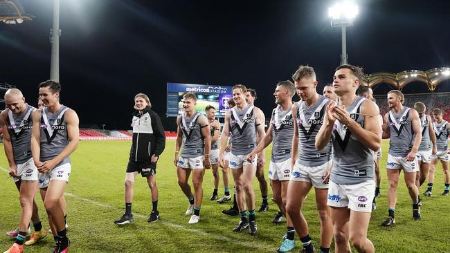 Power players leave the field following their win over Fremantle. (AAP Image/Dave Hunt)