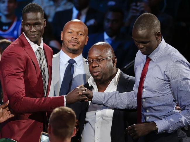 Thon Maker, left, is congratulated by supporters, including his brother, Matur.