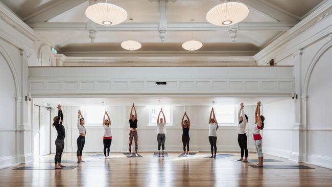 A yoga class in the upstairs studio at Alceme Urban Retreat in Hobart. Picture: ADAM GIBSON