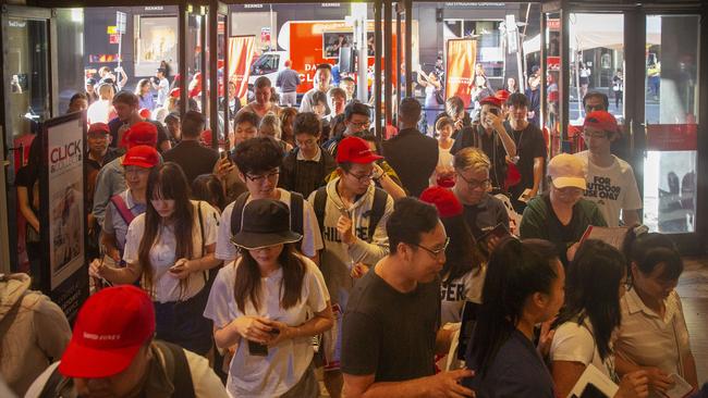 Hordes of people enter David Jones for the beginning of the Boxing Day sales in Sydney today. Picture: Jenny Evans