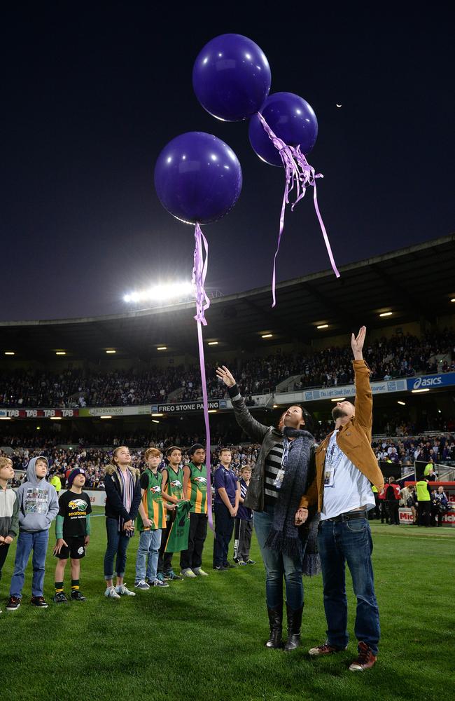 Anthony Maslin and Rin Norris release balloons before the Fremantle-Carlton clash at Patersons Stadium. Picture: Daniel Wilkins