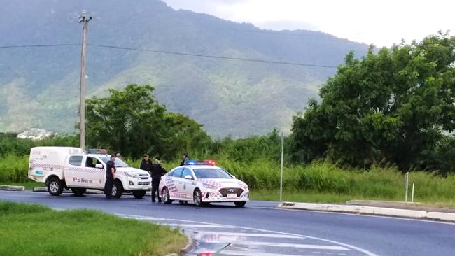 Police at the Holloways Beach roundabout on the Captain Cook Highway Picture: PETER CARRUTHERS