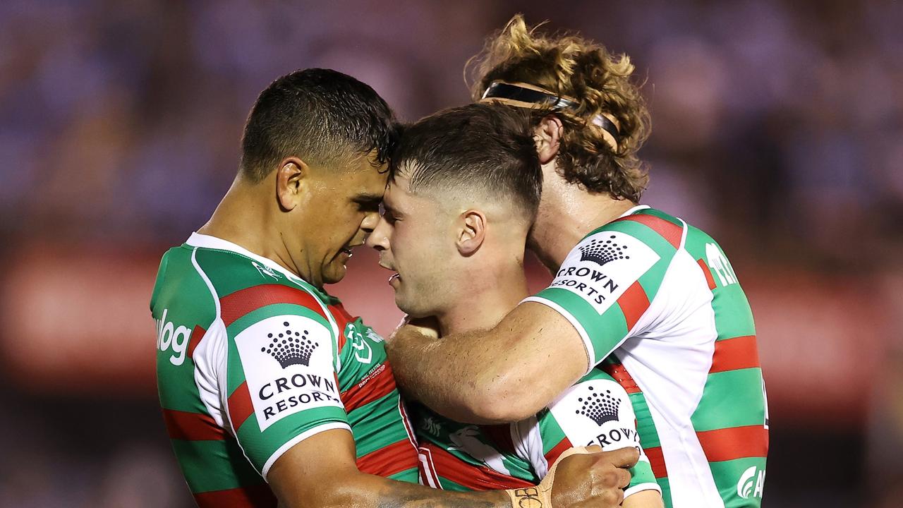 PENRITH, AUSTRALIA - MARCH 04: Latrell Mitchell (l) and Campbell Graham (r) of the Rabbitohs celebrate with Lachlan Ilias (c) of the Rabbitohs during the round one NRL match between Cronulla Sharks and South Sydney Rabbitohs at BlueBet Stadium on March 04, 2023 in Cronulla, Australia. (Photo by Mark Kolbe/Getty Images)