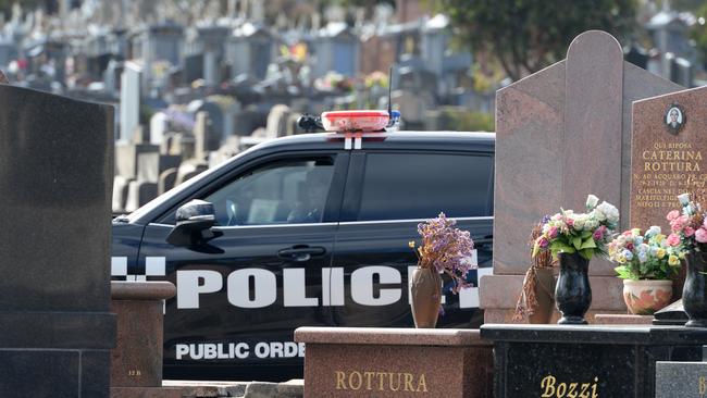 Police at the cemetery investigating the break-in. Picture: Andrew Henshaw