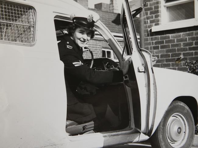 Former police officer Eileen Rainford in the driver’s seat of a paddy wagon. Picture: David Caird