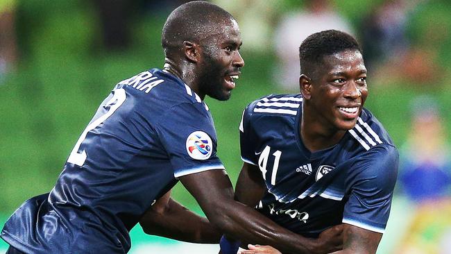 Leroy George celebrates a goal with Jason Geria. (Photo by Michael Dodge/Getty Images)