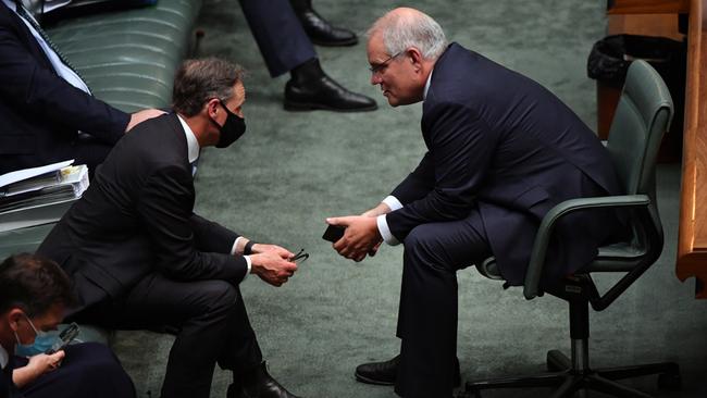 Greg Hunt, left, and Scott Morrison in the House of Representatives at Parliament House in Canberra on Thursday. Picture: AAP