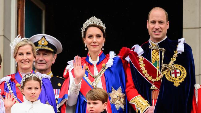 Prince William, the Princess of Wales, Princess Charlotte and Prince Louis wave to the crowds from the Buckingham Palace balcony. Picture: AFP