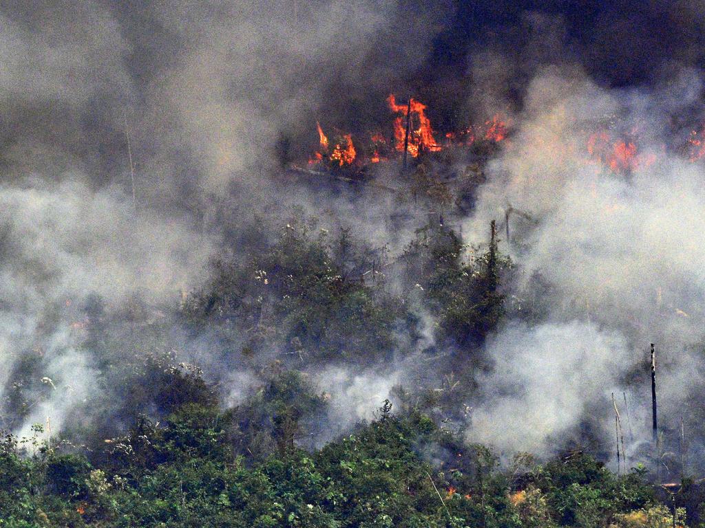 Aerial picture showing smoke from a two-kilometre-long stretch of fire billowing from the Amazon rainforest about 65km from Porto Velho. Picture: AFP