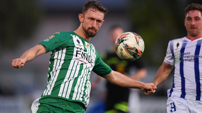 Luke Adams keeps his eye on the ball for Green Gully.