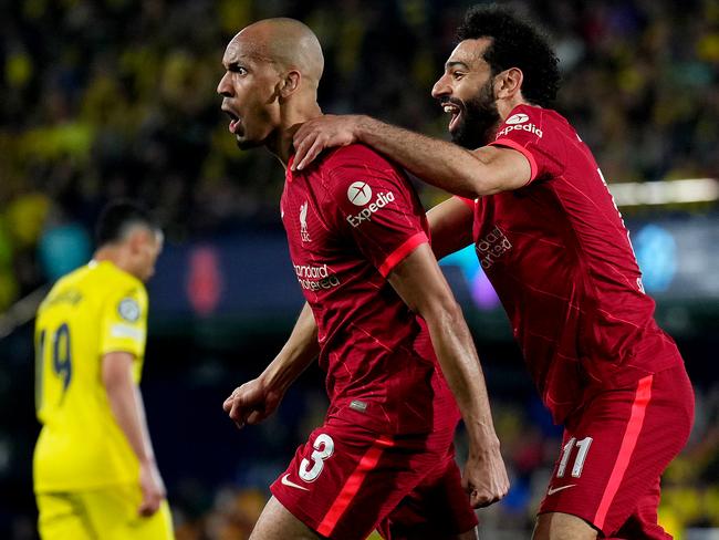 VILLARREAL, SPAIN - MAY 03: Fabinho celebrates with teammate Mohamed Salah of Liverpool after scoring their team's second goal during the UEFA Champions League Semi Final Leg Two match between Villarreal and Liverpool at Estadio de la Ceramica on May 03, 2022 in Villarreal, Spain. (Photo by Aitor Alcalde - UEFA/UEFA via Getty Images)