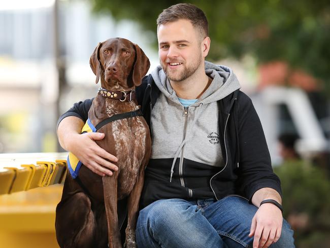 Jeremy Medlock with his psychiatric assistance dog, Frankie. Picture: Richard Dobson