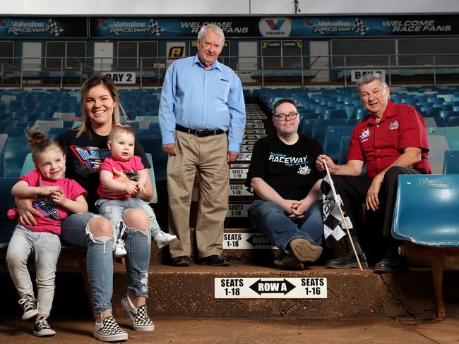 “Speedway is the people,” said Dennis Newlyn (standing) with Mikaela Darcy and her daughters Callie and Addie, Shaun MacDonald and Lance Wilson. Picture: Jonathan Ng