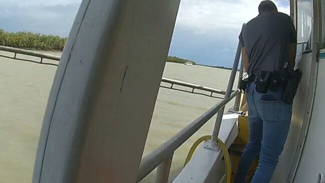 Police officers search a vessel at Karumba allegedly connected to slavery and torture charges. Picture: Queensland Police