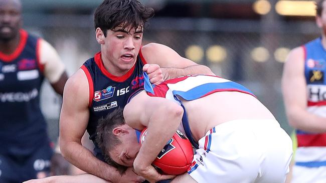 Norwood's Henry Nelligan tackles Central’s Trent Goodrem. Picture: Sarah Reed