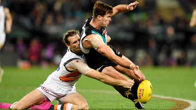 Scott Lycett of Port Adelaide competes with Phil Davis of the Giants. Picture: Mark Brake/Getty Images