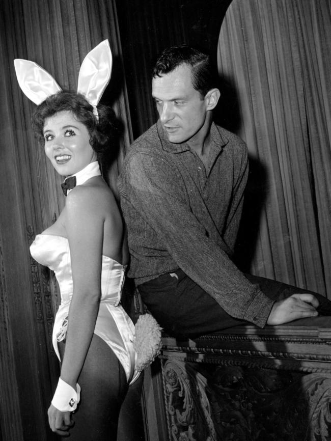 Hefner poses with "bunny-girl" hostess Bonnie J. Halpin at Hefner's nightclub in Chicago, 1962. Pic: AP