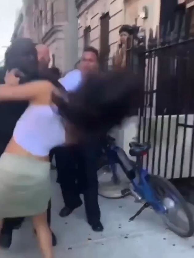 The officer was seen punching her in the face. Picture: Twitter/@etanthomas36