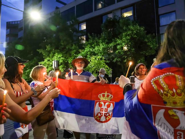 Serbian protesters outside the Park Hotel Melbourne show their support for Djokovic. Picture: Ian Currie