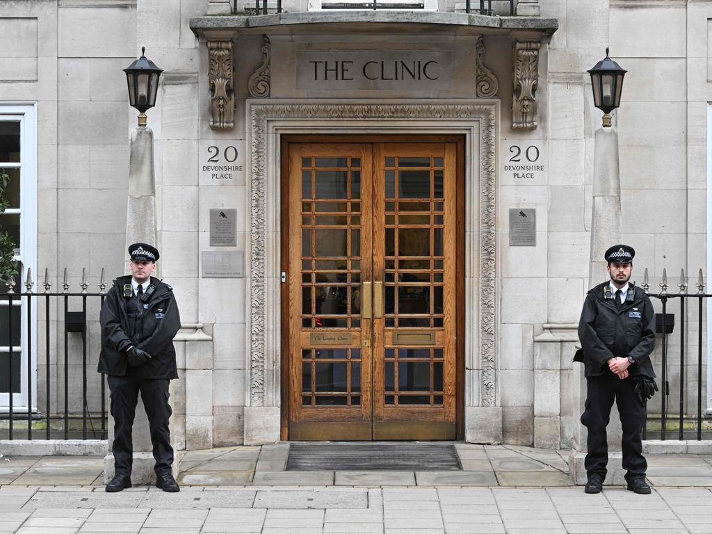 Police officers stand guard outside the London Clinic in London where Princess Catherine will stay for up to two weeks after abdominal surgery. Picture: AFP