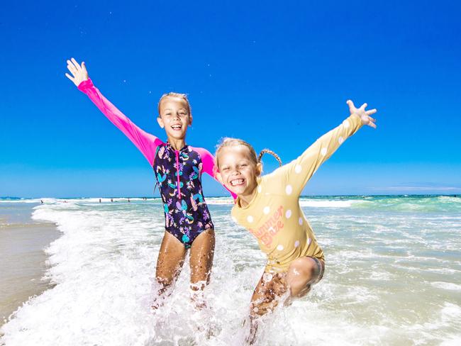 Gold Coast hot weather.The hottest day of the current heatwave will happen on Monday with at least 38 degrees expected.Sienna, 8 (pink sleeves) and Harper, 6 (yellow) McDonald from Mudgeeraba cool off at Tugun beach.Picture: NIGEL HALLETT***( MUM Katie 0412117718 *****
