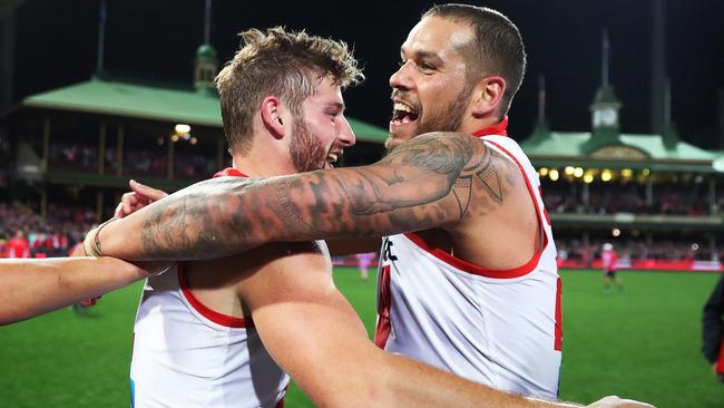 Alex Johnson and Lance Franklin celebrate Sydney’s big win. Picture: Phil Hillyard