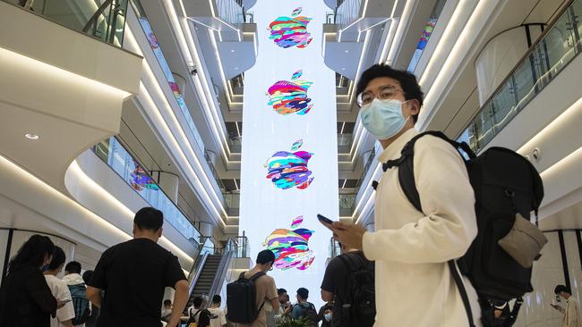 Apple captured a 22 per cent market share for mobile phones in China for the final quarter of 2021 - but its image has taken a hit with CEO Tim Cook accused of bowing to Beijing.