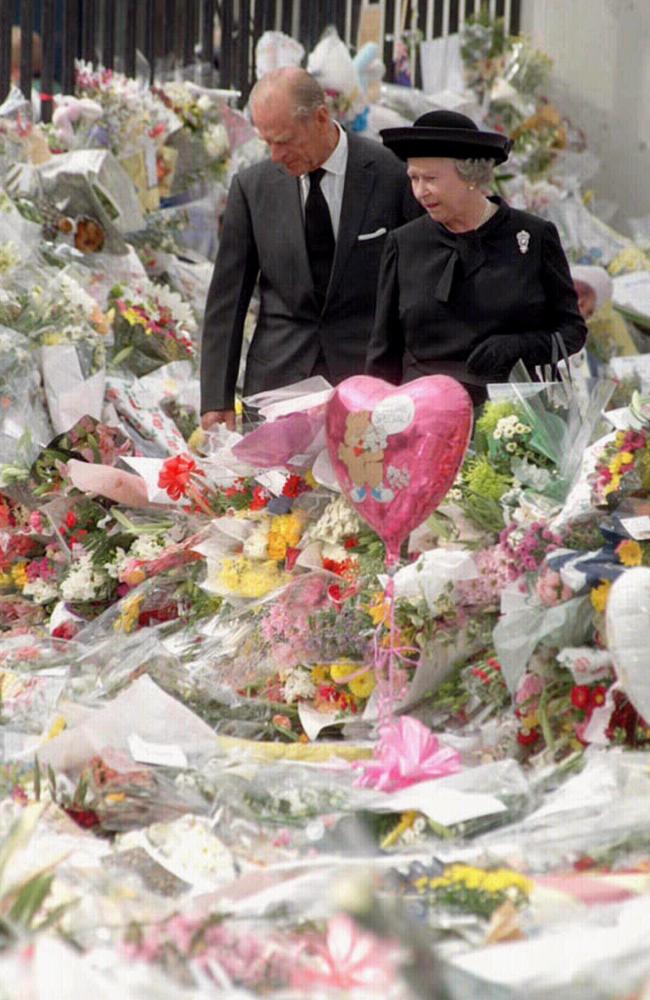 The royal couple view the floral tributes to Diana, Princess of Wales, amid controversy over their response to her tragic death in 1997.